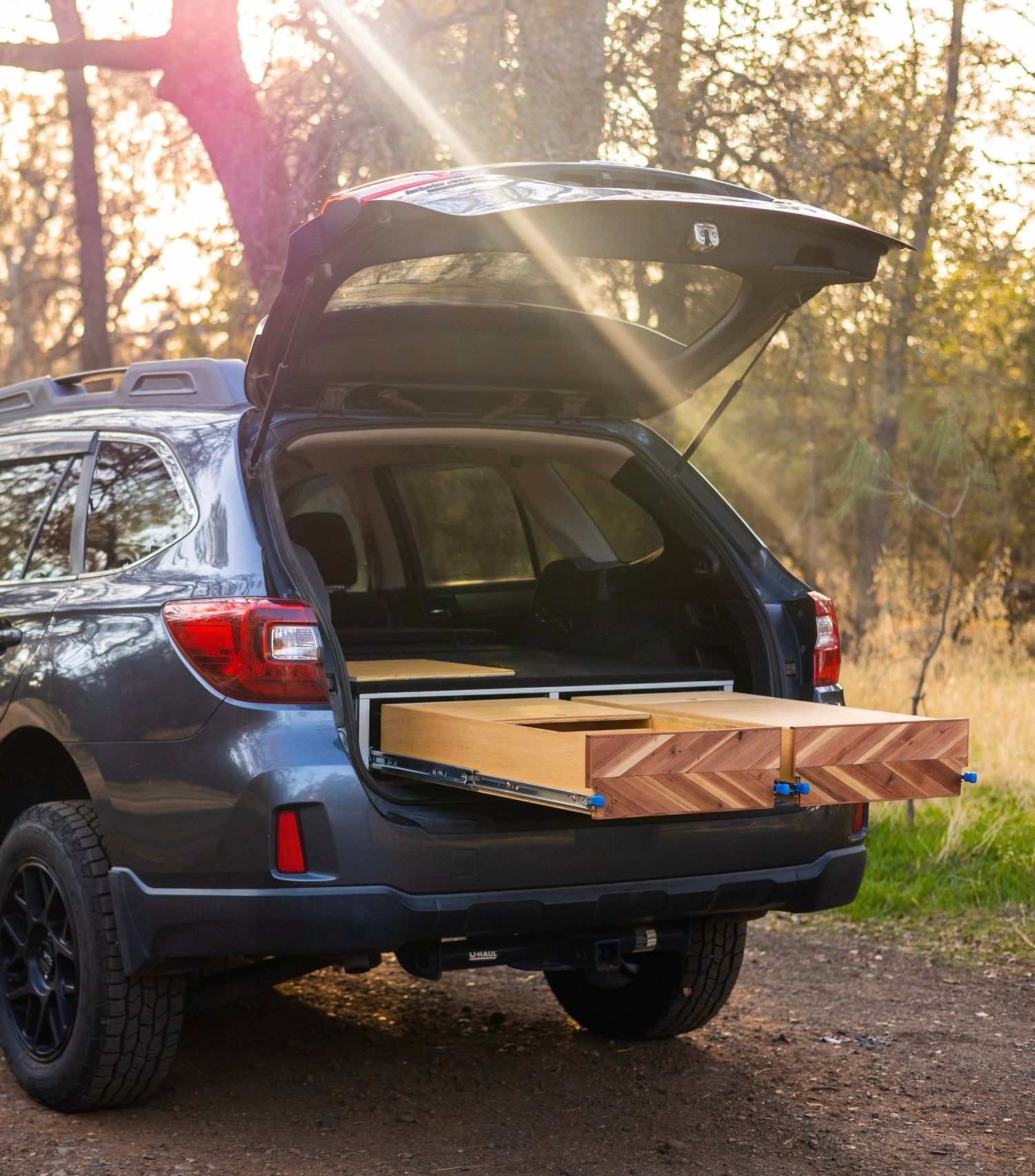 camper conversion kit inside subaru with drawers open