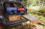 Subaru Crosstrek Camper Conversion Kit cooking food with stove in forest