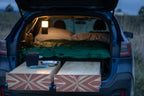 car camping bed in a subaru outback in the outdoors